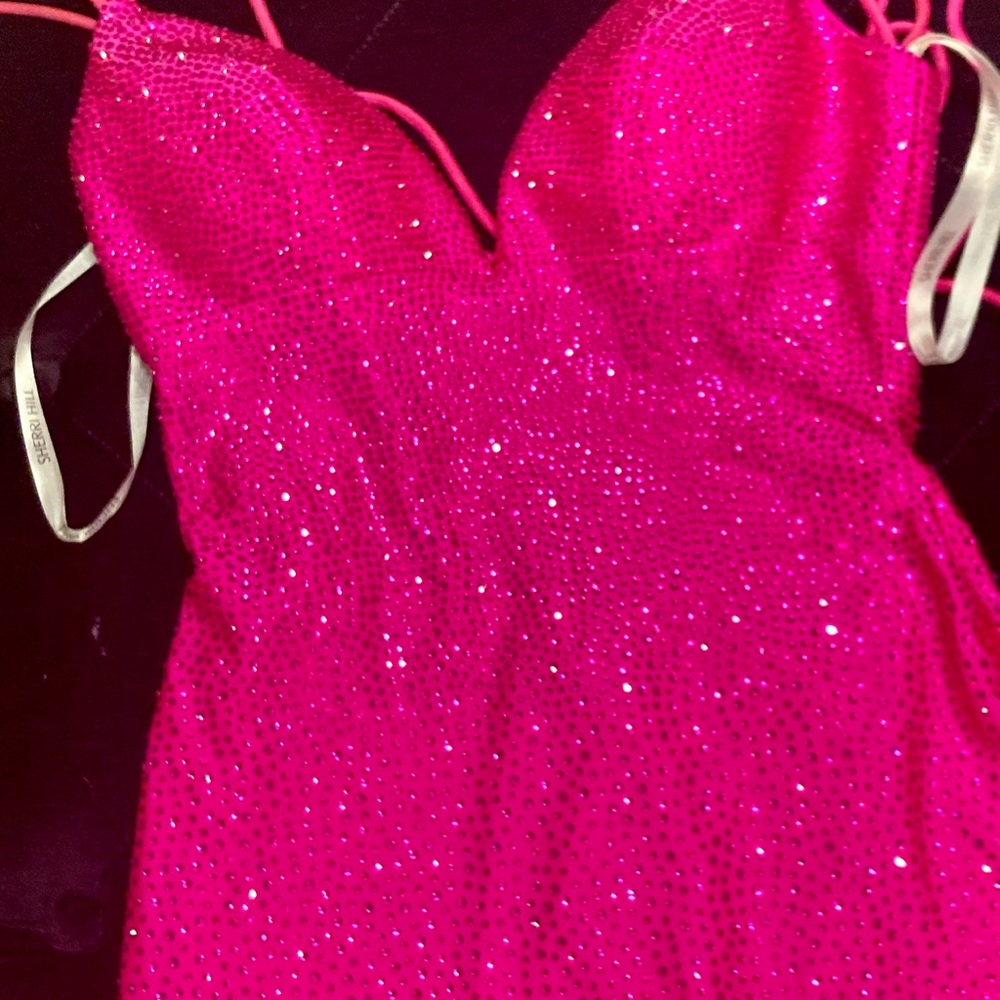 Sherri Hill dress in bright pink with rhinestone detailing, mermaid fit
